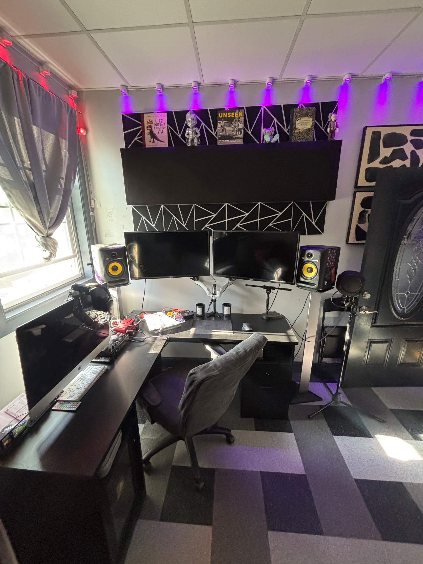 Studio B production desk with dual monitors and purple lighting