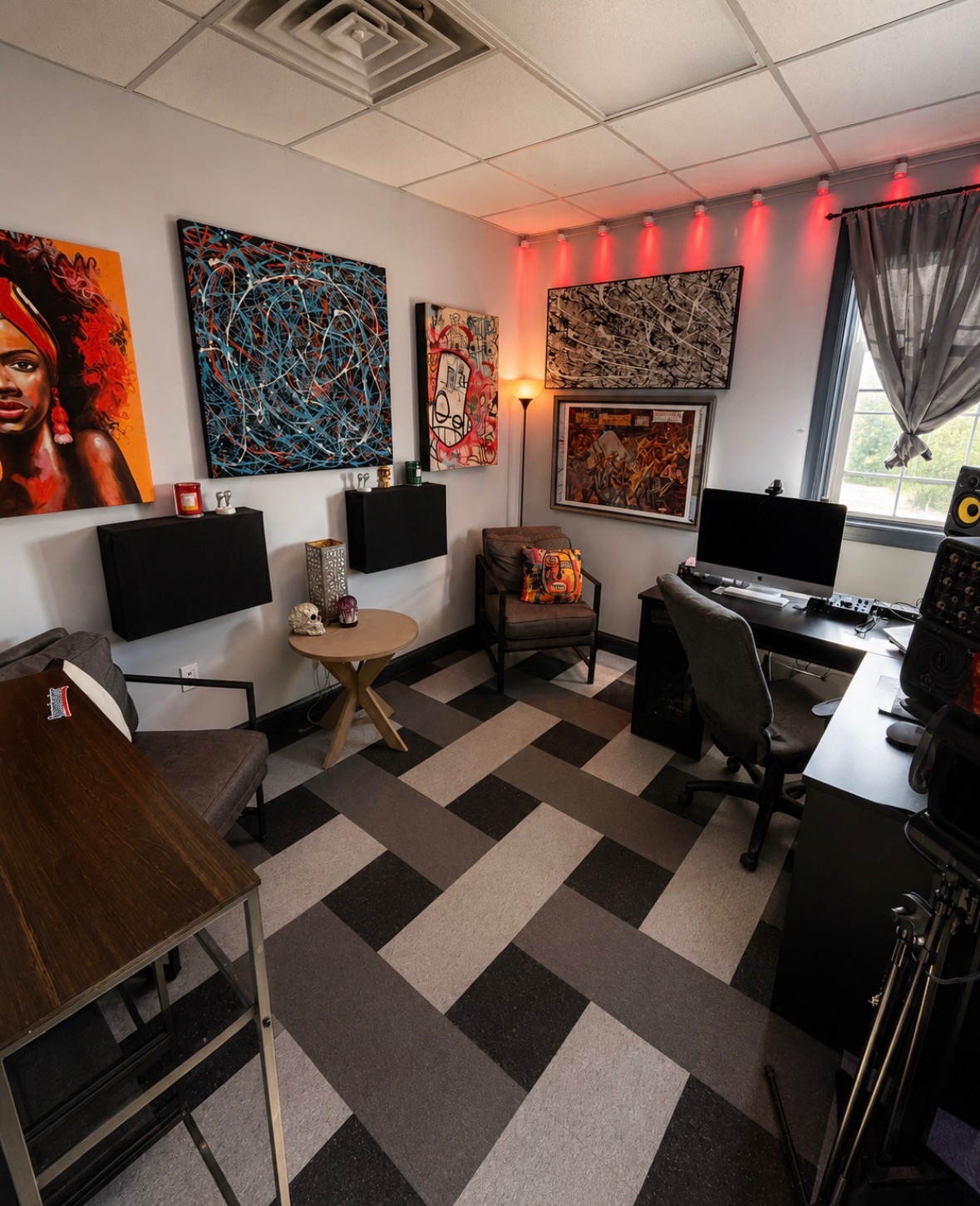 Studio B lounge with artwork and red accent lighting