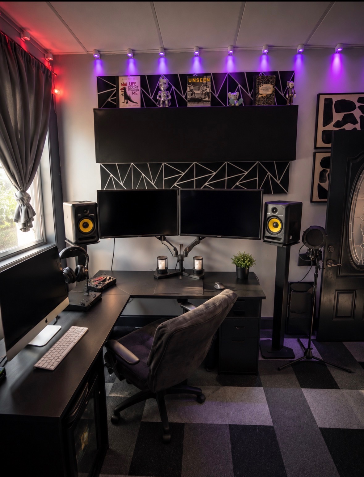 Studio B control room desk with dual monitors and purple accent lighting