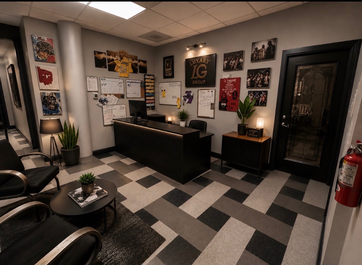 The Luxary Group Co. reception lobby, with the front desk and wall branding